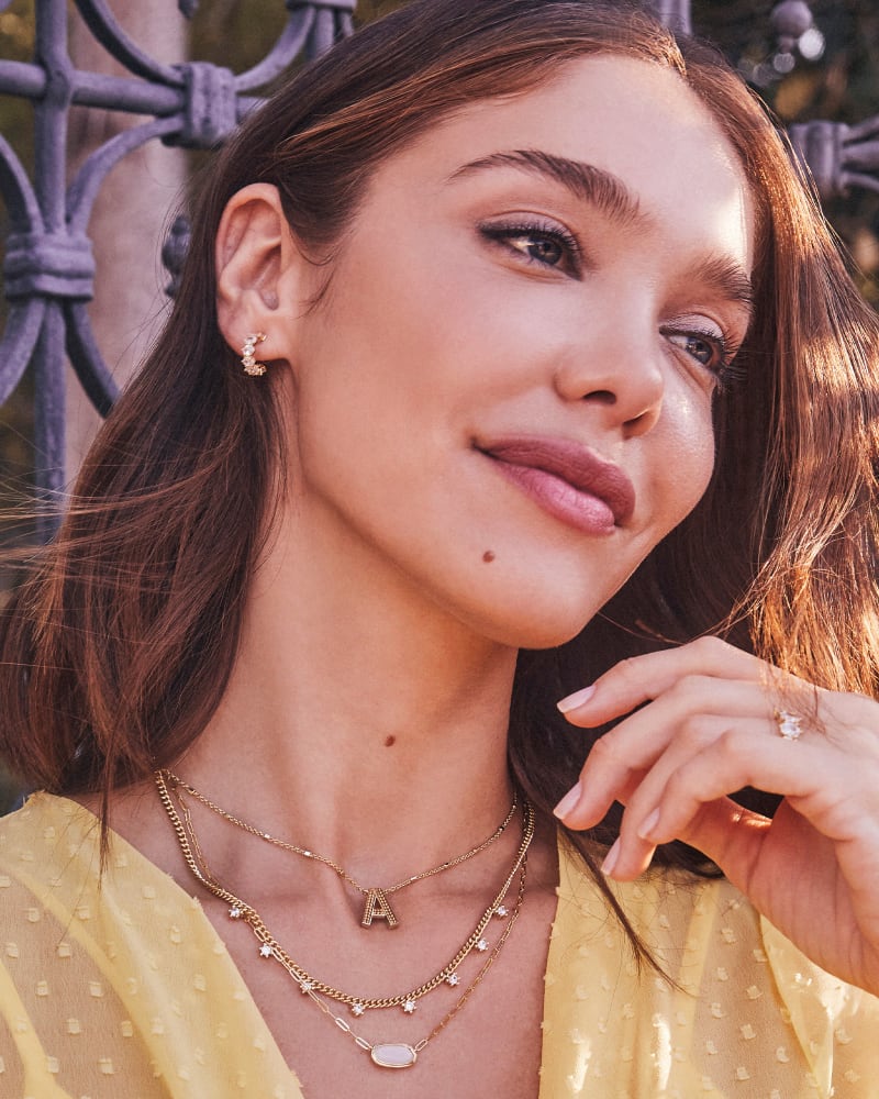  Cailin Gold Crystal Huggie Earrings In White Crystal